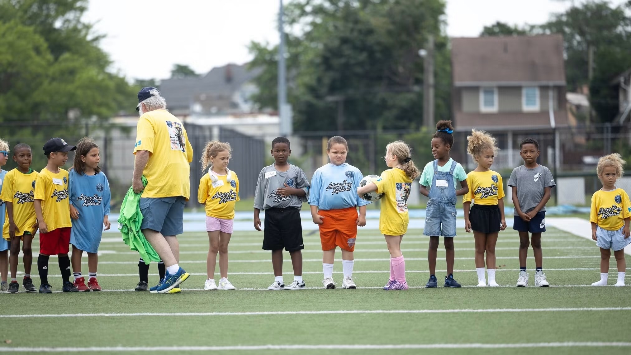 Soccer Showcase II — coach instructing youth players